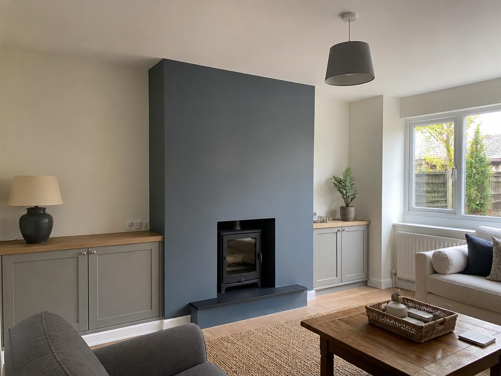 A freshly renovated living room with smooth skimmed walls and clean finishes