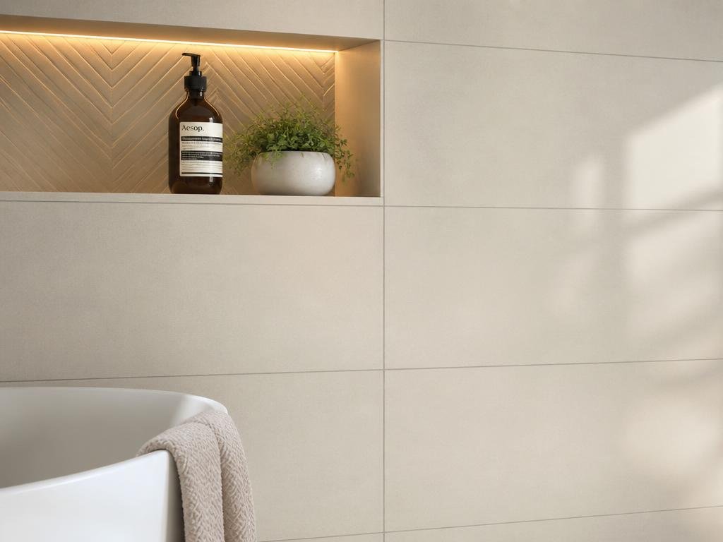 Neatly laid ceramic wall tiles in a modern bathroom with clean grout lines